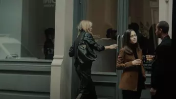 The row Back­pack 11 in Soft Calf Leather worn by Lee (Brit Marling) as seen in A Murder at the End of the World (S01E01)