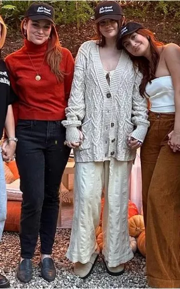 Free People Montana Oversized Cardigan worn by Selena Gomez on Francia Raisa’s Instagram on November 22, 2023