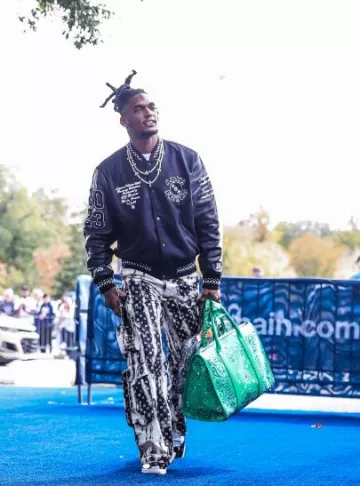 Amiri Black Bleached MA Paisley Cargo Pants worn by CeeDee Lamb on the Instagram account @cee2x___