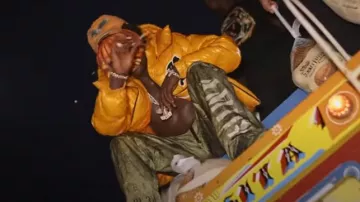 Amiri Olive Green Allover Stencil Cargo Pants worn by Kodak Black in Kylie Grande [Official Music VIdeo]