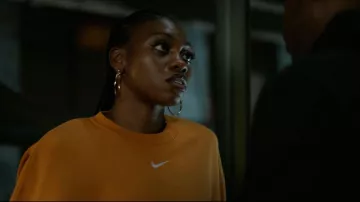 Nike Orange Pheonix Sweatshirt worn by Shanti(Adrienne Walker) as seen in Power Book IV: Force (S02E02)