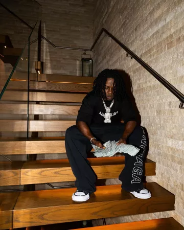 Balenciaga Black Vertical Logo Baggy Sweatpants worn by Jack Boy on the Instagram account @1804jackboy