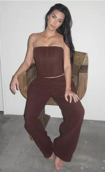 Skims Fleece Lounge Corset in Cocoa worn by Kim Kardashian West on her Instagram Post on December 3, 2023