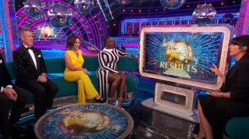 Karen Millen Stripe Knit­ted Maxi Col­umn Dress worn by Motsi Mabuse as seen in Strictly Come Dancing: It Takes Two (S21E02)