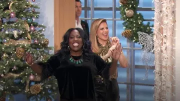 Karl Lagerfeld Paris Feather Cuff Velvet Top worn by Sheryl Underwood as seen in The Talk on December 5, 2023