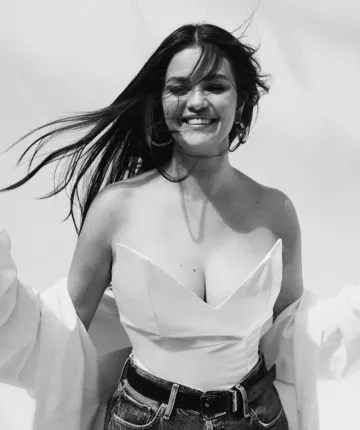 Jenny Bird Slim Doune Hoops Earrings worn by Selena Gomez at Wwd Magazine on December 7, 2023