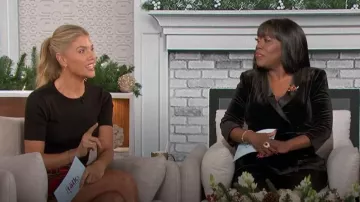 Alex Evenings Satin-Collar Velvet Peplum Top worn by Sheryl Underwood as seen in The Talk on December 8, 2023