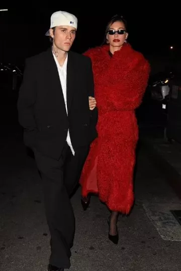 Ferragamo Red Fur Coat worn by Hailey Bieber in La on December 12, 2023