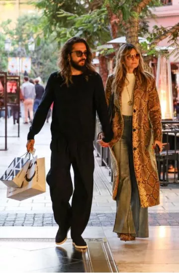 Christian Louboutin Eloise Leop­ard Booties worn by Heidi Klum at Nordstrom on December 11, 2023