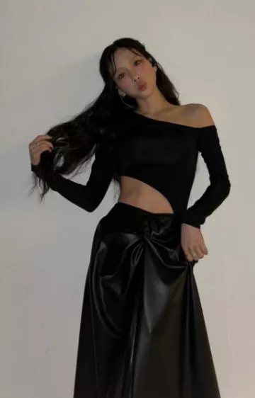 Materiel Asym­met­ric Cutout Body­suit worn by Taeyeon on her Instagram post on December 8, 2023