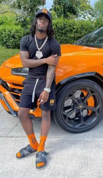 Amiri Orange Bandana Flame Socks worn by Kai Cenat on the Instagram account @kaicenat