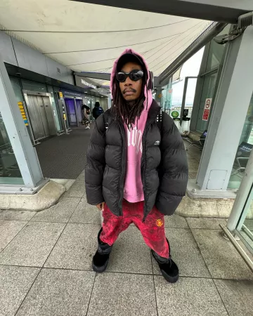 Balenciaga Red 'Skater Graffiti' Sweatpants worn by Wiz Khalifa on the Instagram account @wizkhalifa