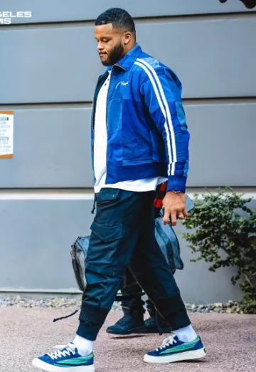 Bolso Louis Vuitton Nigo Black & Grey Striped Keepall 50 usado por Aaron Donald en la cuenta de Instagram @aarondonald99