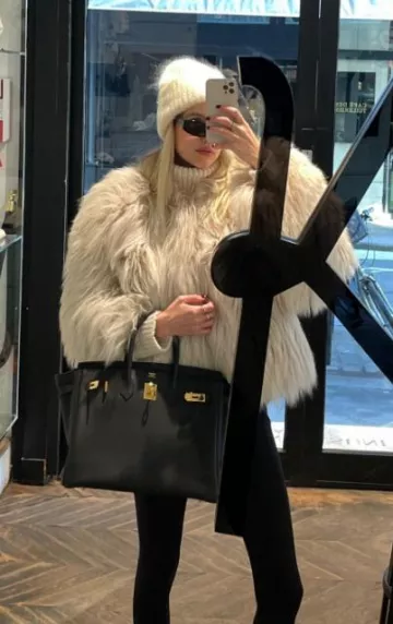 Hermes Birkin Black Togo Gold Hardware worn by Leonie Hanne on her Instagram Story on December 18, 2023