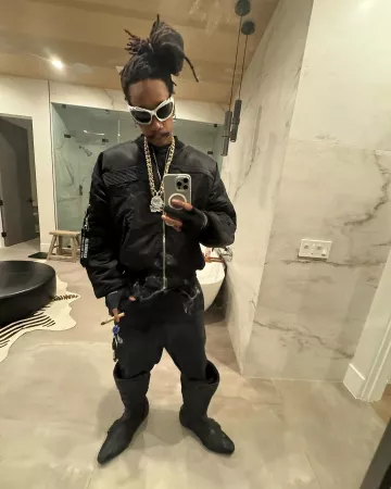 Balenciaga Black Leather Tall Biker Boots worn by Wiz Khalifa on the Instagram account @wizkhalifa