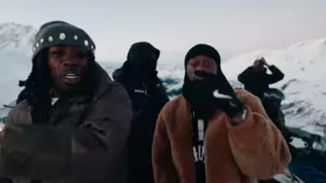 Rhude x Lamborghini Black & White Sleeve Polo worn by Tiakola in GAZO x @TiakolaOfficiel - CARTIER