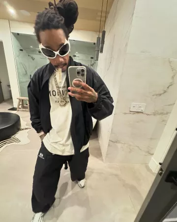 Balenciaga x Erewhon White Logo T-Shirt worn by Wiz Khalifa on the Instagram account @wizkhalifa