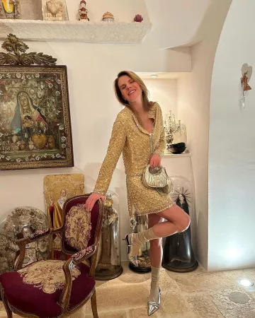 Miu Miu Ribbed Knit Denim Bra worn by Anna Dello Russo on her Instagram post on December 25, 2023