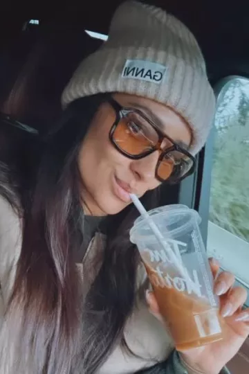 Ganni Ribbed Beanie worn by Shay Mitchell on her Instagram Story on December 25, 2023