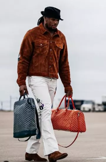 Goyard Red 'Boston 45' Bag worn by Derrick Henry on the Instagram account @derrick_.henry