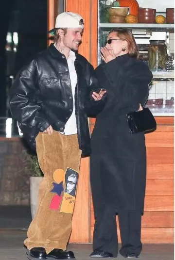 Ferragamo Wanda Mini Leather Tote Bag worn by Hailey Bieber in Los Angeles on December 10, 2023