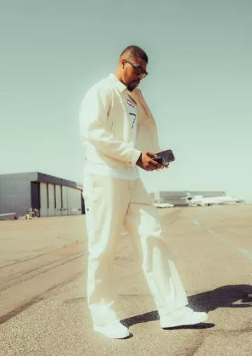 Prada All White Triangle Logo Downtown Sneakers worn by Presnel Kimpembe on the Instagram account @kimpembe3