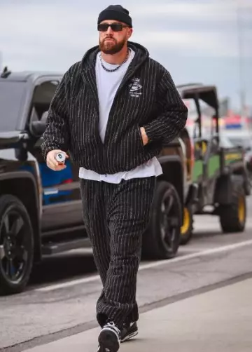 Nike Stussy Black Pinstriped Pants worn by Travis Kelce on the Instagram account @killatrav