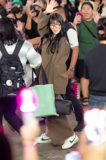 The Row Dhani Coat worn by Tiffany at Suvarnabhumi Airport on January 1, 2024