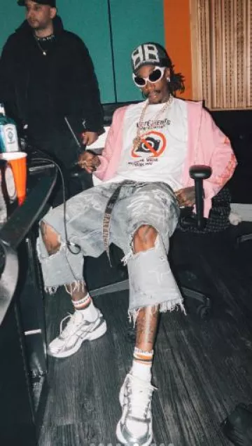 Chrome Hearts White & Orange-Stripe Logo Socks worn by Wiz Khalifa on the Instagram account @wizkhalifa