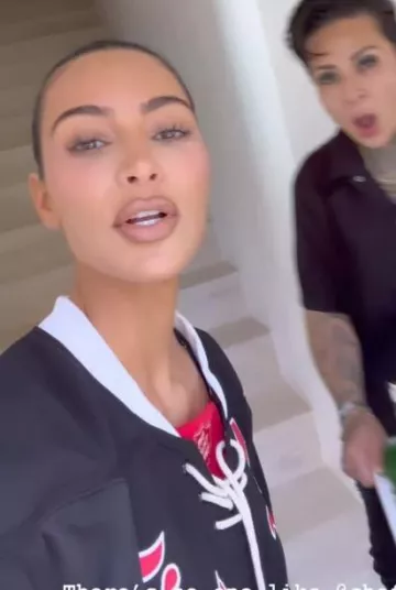 Saint Michael Saint Supernatural 28 Logo-Appliqued Striped Mesh T-Shirt worn by Kim Kardashian on her Instagram Story on December 9, 2023