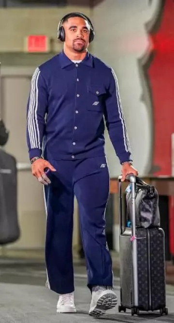 Black Monogram 'Horizon 55' Rolling Suitcase worn by Jalen Hurts on the Instagram account @jalenhurts