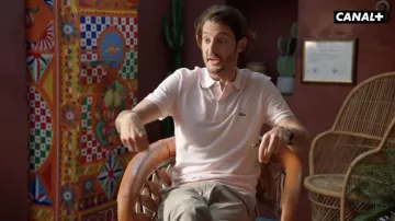 The Lacoste polo shirt worn by Dr. Juiphe (Pierre Niney) in the series Le Flambeau: Les aventuriers de Chupacabra