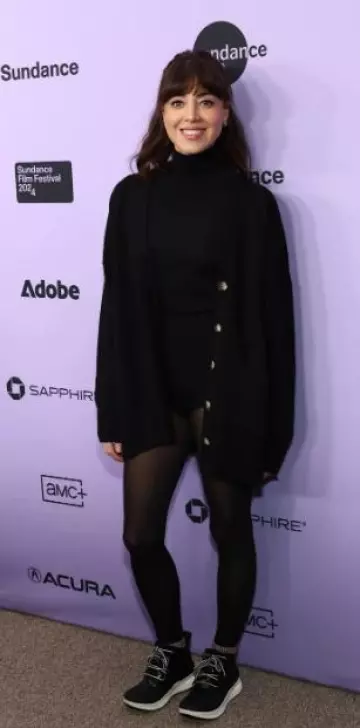 Naked Cashmere Black Lily Cardigan worn by Aubrey Plaza at  My Old Ass Premiere at Sundance Film Festival on January 20, 2024