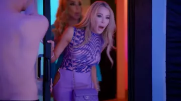 Chanel Dou­ble Flap Pur­ple worn by Lisa Hochstein as seen in The Real Housewives of Miami (S06E13)