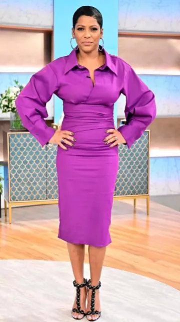 Alaia Bombe Patent T-Strap Sandal worn by Tamron Hall at The Tamron Hall Show 5.86 on January 25, 2024