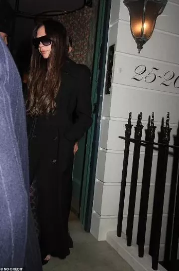 Saint Laurent Chica Slingback in Tpu and Patent Leather in Black worn by Victoria Beckham Out and About in London on January 27, 2024