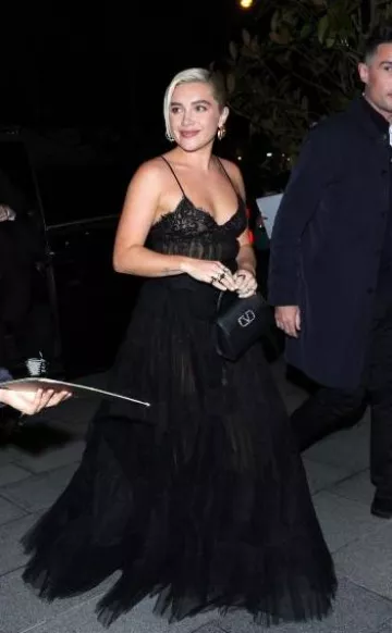 Valentino Vsling Small Leather Top-Handle Bag worn by Florence Pugh in Paris  on January 24, 2024