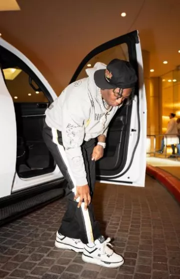 Rhude Black & Gold Desert Hill Champ Hat worn by Fredo Bang on the Instagram account @fredobang