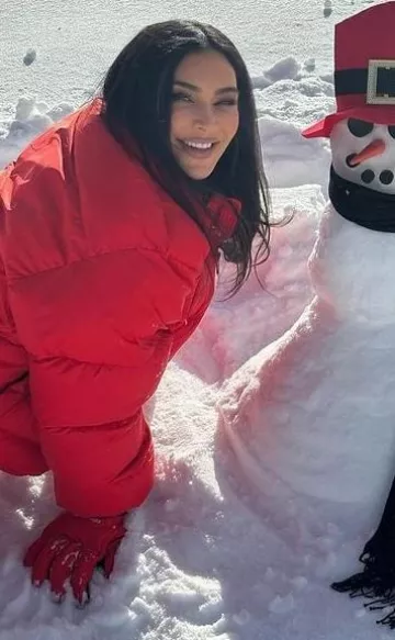 Balenciaga 3B Sports Icon Ski Puffer in Red worn by Kim Kardashian on her  Instagram on February 1, 2024
