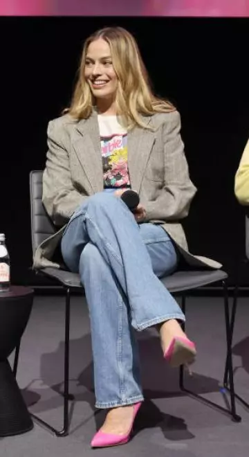 Bottega Veneta High-Rise Straight Jeans worn by Margot Robbie at Barbie Screening and Q&a  on January 30, 2024