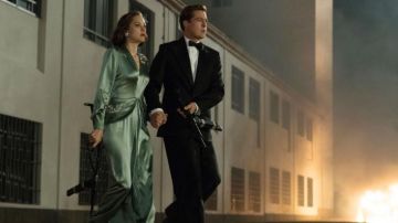 El vestido de raso verde de Marianne Beauséjour (Marion Cotillard) en Alliès