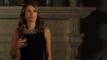 The black dress Calvin Klein queen Helena (Elizabeth Hurley) in The Royals S03E02