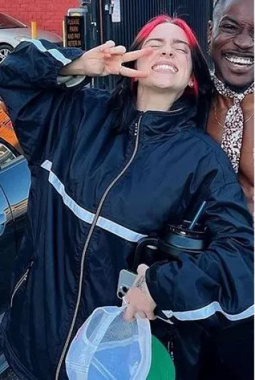 Nike Vintage Windbreaker Jacket worn by Billie Eilish on Fan Photo on February 2, 2024