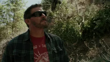 SEAL Team Outfits: Jason Hayes (David Boreanaz) is wearing Tiger "Doing > Talking" Printed T-shirt in red in season 6, episode 6 of the TV series