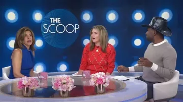 Black Halo Zana Twisted Halter-Neck Jumpsuit worn by Hoda Kotb as seen in Today with Hoda & Jenna on February 12, 2024