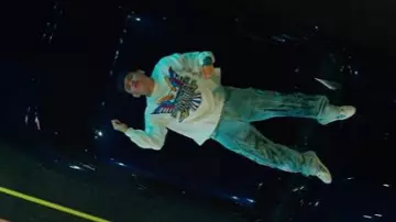 Who Decides War Blue Statue Of Liberty Print Jeans worn by Junior H in A Tu Manera with Peso Pluma [Video Oficial]