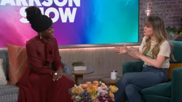 Urban outfitters Nir­vana Dis­tressed T-Shirt Dress worn by Kelly Clarkson as seen in The Kelly Clarkson Show on February 27, 2024