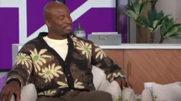 Nanushka Taiki Cardigan worn by Akbar Gbaja-Biamila as seen in The Talk on February 29, 2024