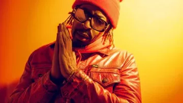 The chunky, distressed red leather jacket worn by Lil Jon in Lil Jon Photoshoot: Behind The Scenes!