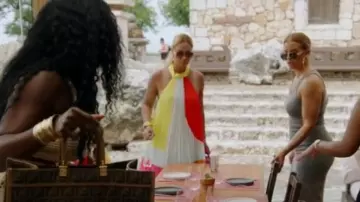 Alice + Olivia Aviana Hal­ter­neck Sun­burst Pleat­ed Mini Dress worn by Gizelle Bryant as seen in The Real Housewives of Potomac (S08E15)